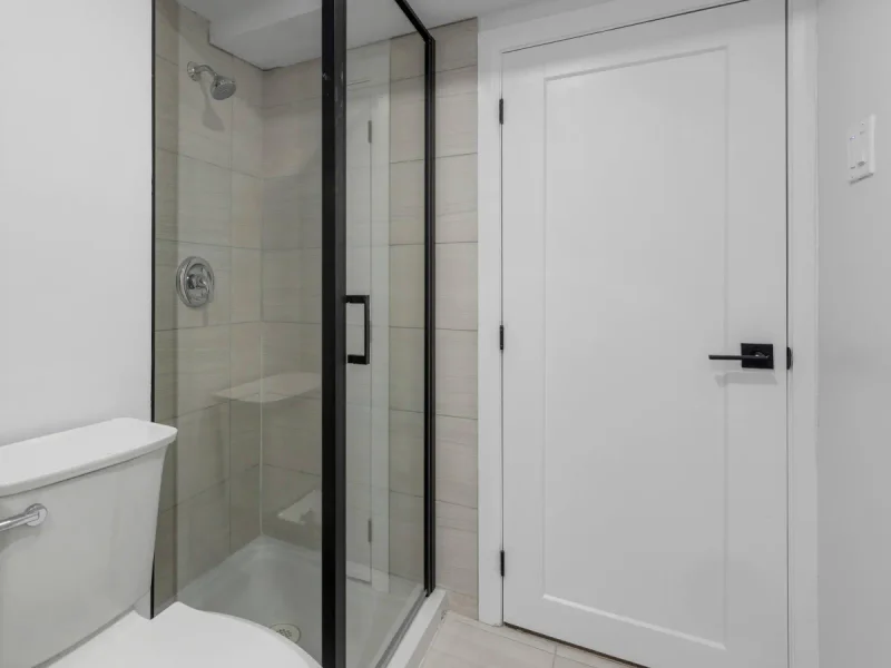Black-framed glass shower screen